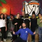 Groepsfoto met onze instructeur en een aantal ondernemers die Archery Tag hebben gespeeld.